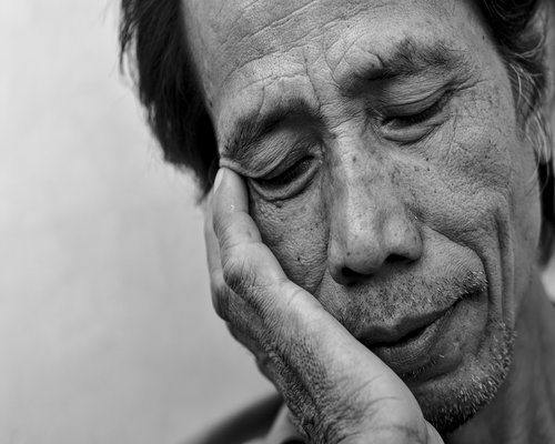 Man tired working late at home